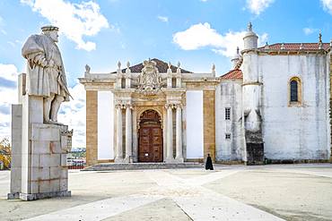 A student in traditional cloth walking through University of Coimbra, one of the oldest universities in Europe, Coimbra, Portugal, Europe