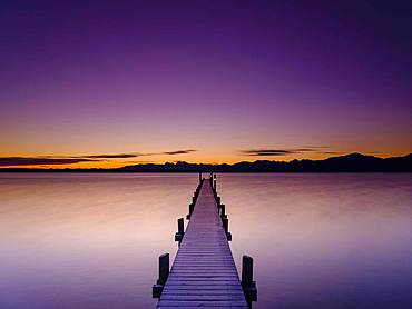 Footbridge at Chiemsee at dawn, behind the Chiemgau Alps, Chiemgau, Upper Bavaria, Bavaria, Germany, Europe