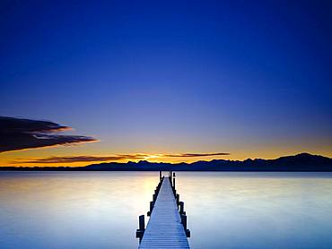 Footbridge at Chiemsee at sunrise, behind the Chiemgau Alps, Chiemgau, Upper Bavaria, Bavaria, Germany, Europe