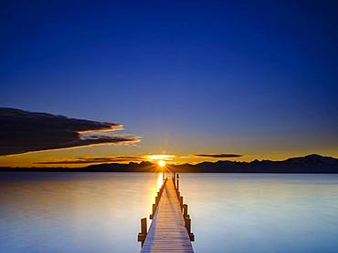 Footbridge at Chiemsee at sunrise, behind the Chiemgau Alps, Chiemgau, Upper Bavaria, Bavaria, Germany, Europe