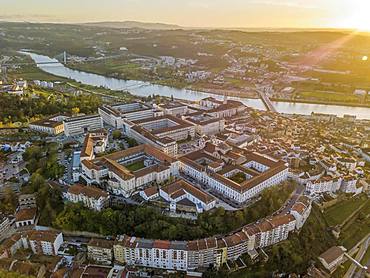 Aerial view of Coimbra with university at top of the hill at sunset, Portugal, Europe