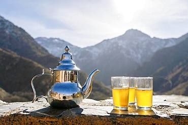 Moroccan mint tea and kettle in High Atlas mountains, Aroumd, Morocco, Africa