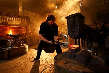 Blacksmith at the forge hammer, hammer mill Burghausen, Upper Bavaria, Bavaria, Germany, Europe