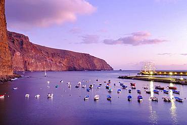 Fishing boats in the fishing port at dusk, Vueltas, Valle Gran Rey, La Gomera, Canary Islands, Spain, Europe