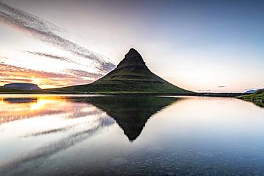 Mountain Kirkjufell reflected in the water, sunset, Grundarfjoerdur, Snaefellsnes Peninsula, Snaefellsnes, Vesturland, Iceland, Europe