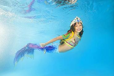 Girl in mermaid costume posing under water, Ukraine, Europe