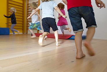 Children run, romp barefoot in kindergarten, Cologne, North Rhine-Westphalia, Germany, Europe