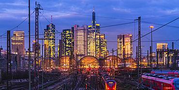 Train and tracks in front of main station and skyline Frankfurt Main in the evening, Gutleutviertel, Frankfurt, Hesse, Germany, Europe