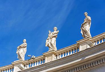 Statues of Saints Balbina, St. Lucy and St. Olympias on Bernini colonnades, St. Peter's Square, Vatican, Rome, Italy, Europe