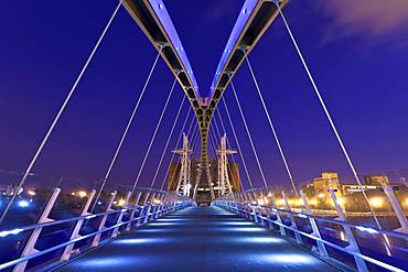 The Lowry bridge during blue hour, Salford Quays, Manchester, England, United Kingdom, Europe