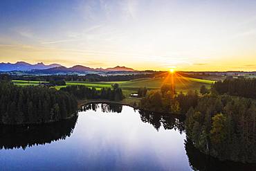 Sunset at the Schmutterweiher pond, near Rosshaupten, drone shot, Ostallgaeu, Allgaeu, Alpine foreland, Swabia, Bavaria, Germany, Europe