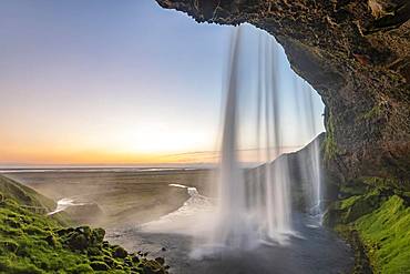 Waterfall Seljalandsfoss at sunset, Southern Iceland, Iceland, Europe