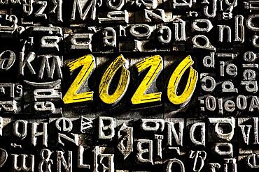 Old lead letters with golden writing show the word 2020, Germany, Europe