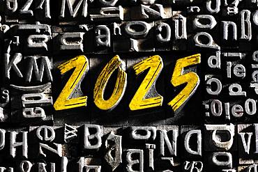 Old lead letters with golden writing show the word 2025, Germany, Europe