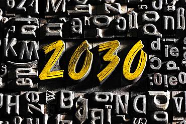 Old lead letters with golden writing show the word 2030, Germany, Europe