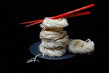 Asian nest noodles with red chopsticks, Germany, Europe