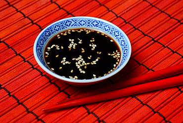 White sesame seed with soy sauce in small bowl, Germany, Europe