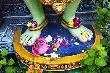 Lotus flowers are laid at the feet of the god Krishna, Shri Krishnan Hindu temple, Bugis, Singapore, Asia