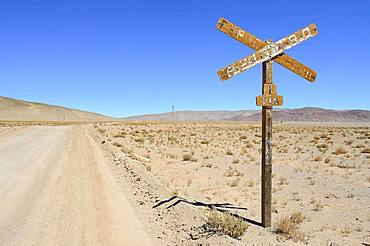 Weathered sign level crossing, Laguna Seca, Ruta 27, Puna, Salta Province, Argentina, South America