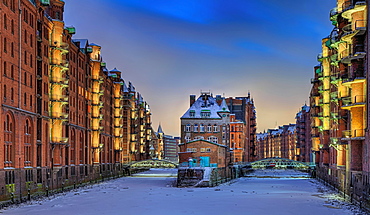 Castle in the Speicherstadt with snow in winter, evening mood, Hamburg, Germany, Europe