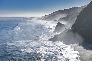 View from the coastal road, unspoiled rocky coast with sea spray, West Coast, Punakaiki, West Coast Region, New Zealand, Oceania