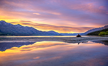 Mountains reflected in the lake, Lake Wakatipu at sunrise, Kinloch, Glenorchy near Queenstown, Otago, South Island, New Zealand, Oceania