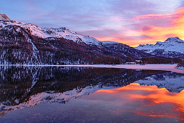 Evening mood at the Lake Silvaplana, behind snow-covered Piz da la Margna, St. Moritz, Canton Graubuenden, Switzerland, Europe