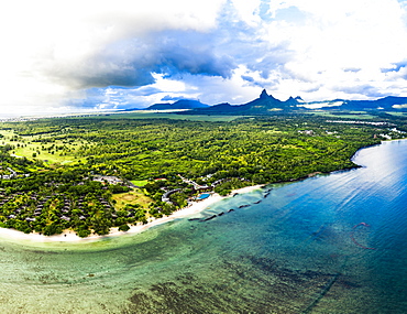 Aerial view, the beach of Flic en Flac with luxury hotels and palm trees, in the back the mountain Trois Mamelles, Mauritius, Africa