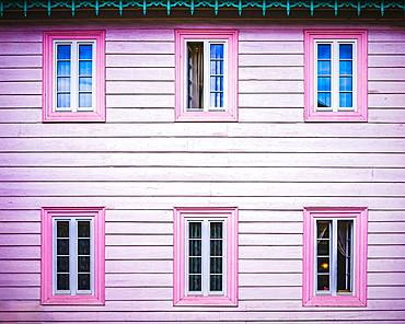 Pink wooden facade with windows, architectural detail, Poland, Europe