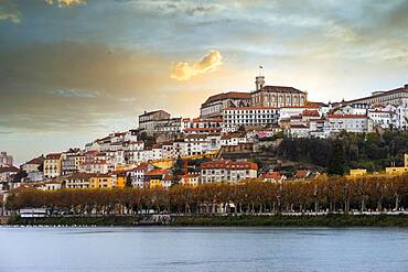 Coimbra cityscape with Mondego river by sunset, Portugal, Europe