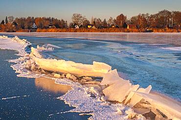 Ice on the frozen dolmen in winter, Lembruch, Lower Saxony, Germany, Europe