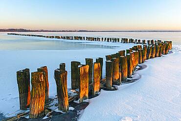 Ice on the frozen dolmen in winter, Lembruch, Lower Saxony, Germany, Europe