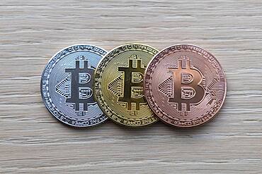 Symbol image digital currency, physical coin Bitcoin, silver, gold, bronze