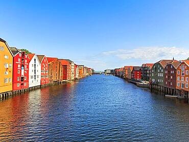 Colourful historic warehouses by the river Nidelva, Trondheim, Trondelag, Norway, Europe