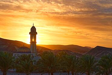 Mosque with palm trees at sunset at Malikia Resort Abu Dabbab, Hilton Nubian Resort, Al Qusair, Marsa Alam, Egypt, Africa