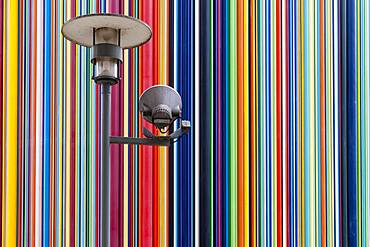 Colourful striped sculpture and street lamp, la Defense, Paris, France, Europe