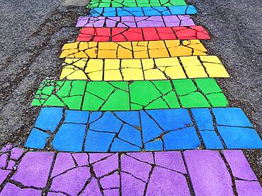 Colourful painted stone slabs, pavement, footpath in the colours of the rainbow, Seyoisfjoerour, Seydisfjoerdur, East Iceland, Iceland, Europe