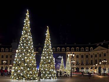 Night shot of illuminated Christmas trees at Place Vendome, Paris, France, Europe