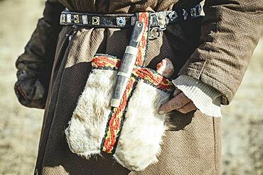 Hunting utensils by eagle hunter Bashakhan Spai, fur bag, Kazakh knife, bones to curl the eagle, Kisil Char, Olgii, Mongolia, Asia