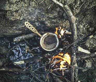 Coffee on campfire, prepared by refugees in the camp Idomeni, Greece, Europe