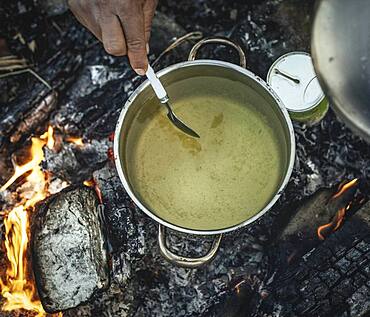 Pea soup on campfire, prepared by refugees in the camp Idomeni, Greece, Europe