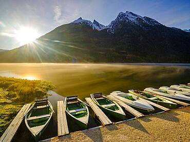 Rowing boats at Hintersee with morning fog at sunrise, in the back Hochkalter, Berchtesgaden National Park, Ramsau, Upper Bavaria, Bavaria, Germany, Europe