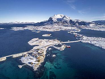 Aerial view, country road through the sea connects populated, small, winterly islands with the mainland, behind mountains, Heroy, Nordland, Norway, Europe