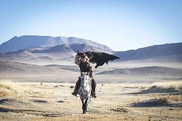 Spai Bashakhan's son during training for the Mongolian equestrian game Buzkaschi, Olgii Province, Mongolia, Asia