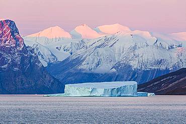 Iceberg in fjord, sunrise, Emperor Franz Joseph Fjord, east coast Greenland, Denmark, Europe