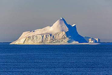 Iceberg in blue sea, east coast Greenland, Denmark, Europe