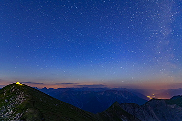 Starry sky summit of Kreuzspitze and tent, Lechtal Alps in the background, Elmen, Lechtal Alps, Ausserfern, Tyrol, Austria, Europe