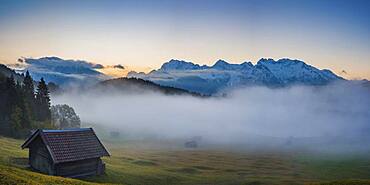 Sunrise and morning fog, Geroldsee, behind it the Karwendel Mountains, Werdenfelser Land, Upper Bavaria, Bavaria, Germany, Europe