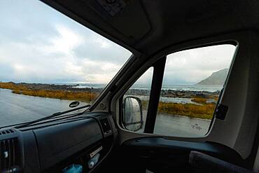 View from a rainy campervan window on Flakstad beach, Flakstad, Lofoten, Norway, Europe