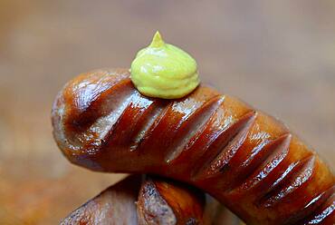 Grilled, sliced sausages with mustard, Germany, Europe